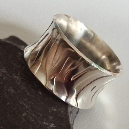 Flared sterling silver band rings